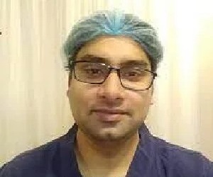 Dr. Alok T